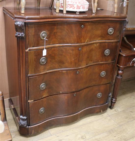 A late 19th century French mahogany serpentine front chest of four long drawers W.112cm